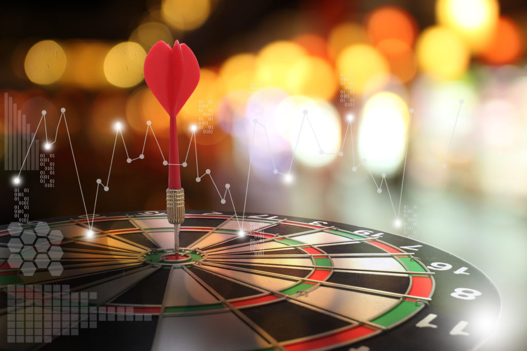 target dart with arrow over blurred background