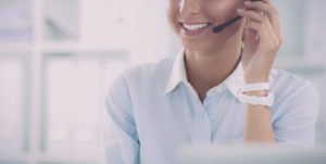 Woman smiling into headset
