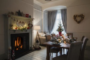Christmas time home with fireplace and dining room